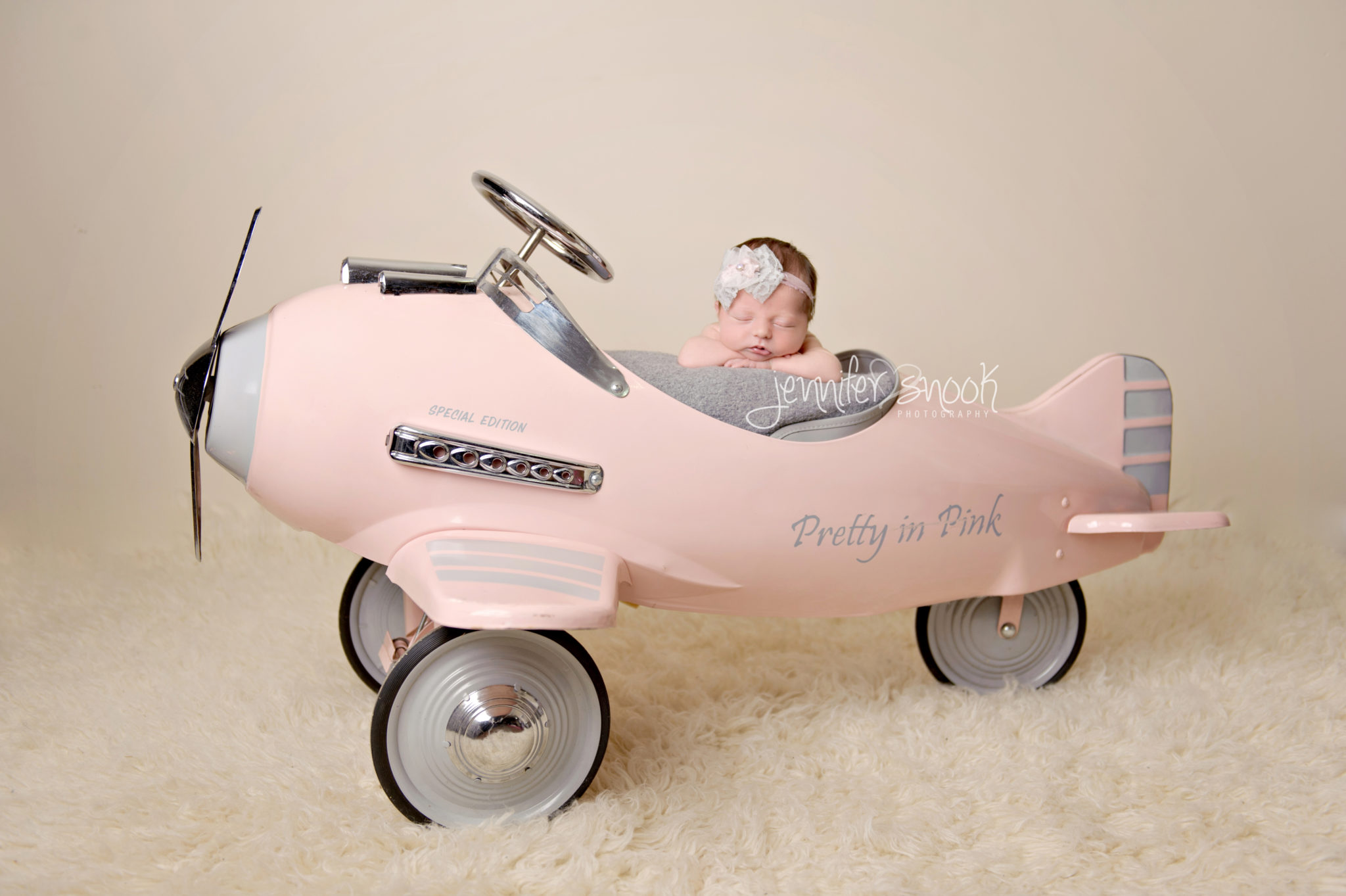Newborn in airplane prop
