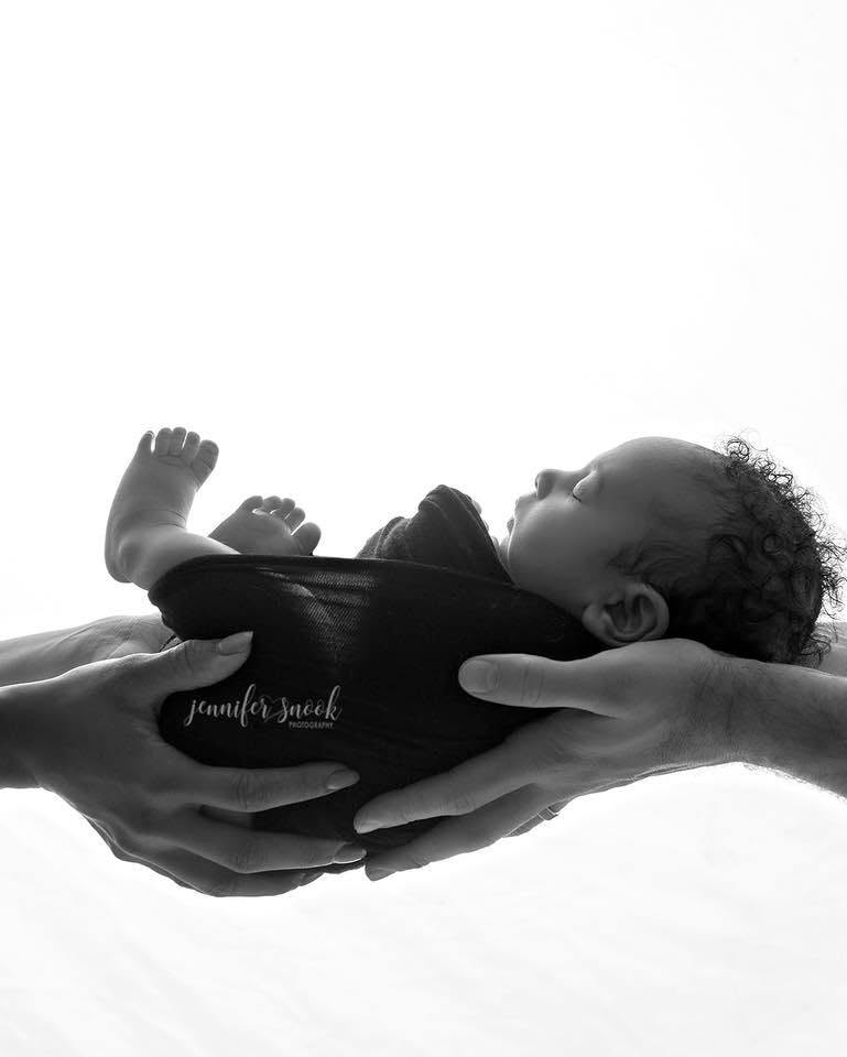 Newborn photography near me, black and white newborn pictures, mom and dad holding newborn